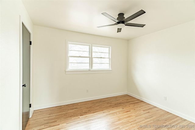 empty room featuring ceiling fan and light hardwood / wood-style floors