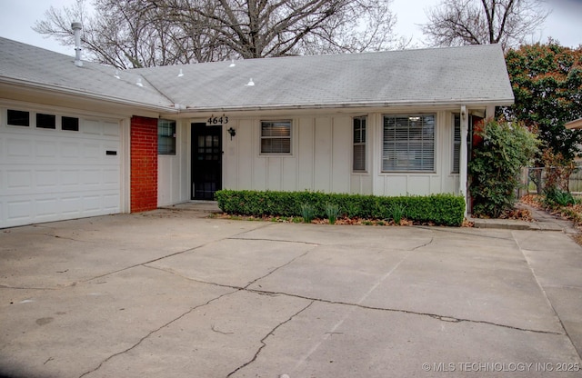 ranch-style home featuring a garage