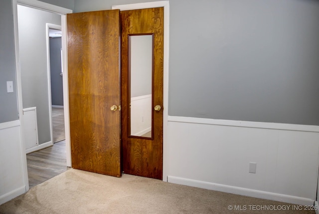 unfurnished bedroom with carpet