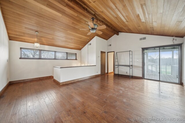 unfurnished living room with visible vents, baseboards, vaulted ceiling, and a healthy amount of sunlight