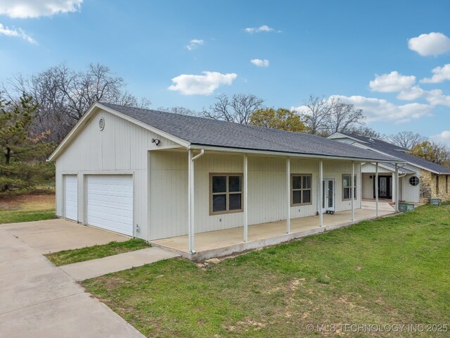 view of home's exterior featuring an attached garage, a yard, a shingled roof, and concrete driveway