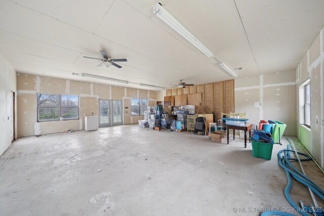 interior space featuring a ceiling fan