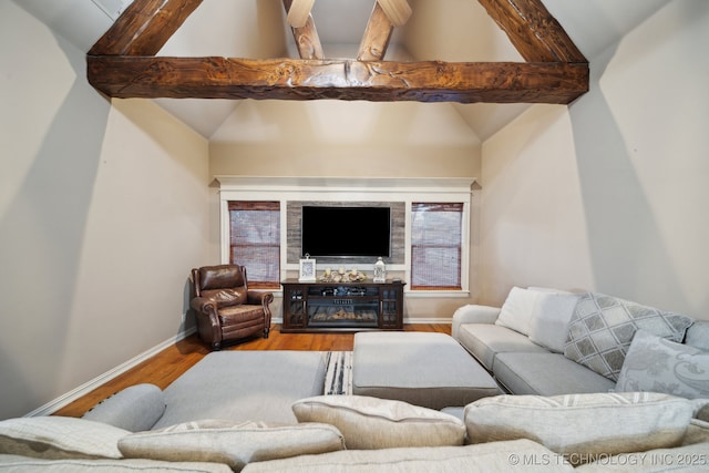 living room featuring hardwood / wood-style floors and lofted ceiling with beams