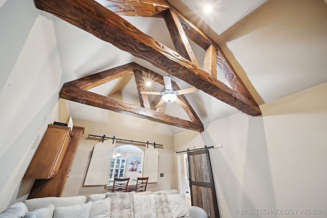 details featuring beamed ceiling, ceiling fan, and a barn door