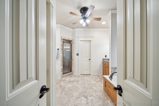 bathroom with ceiling fan, ornamental molding, vanity, and plus walk in shower