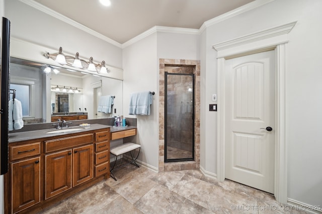 bathroom with vanity, ornamental molding, and a shower with door