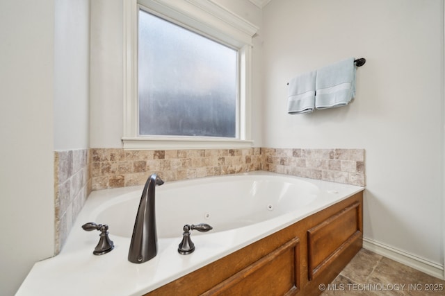 bathroom with tile patterned floors and a bathtub