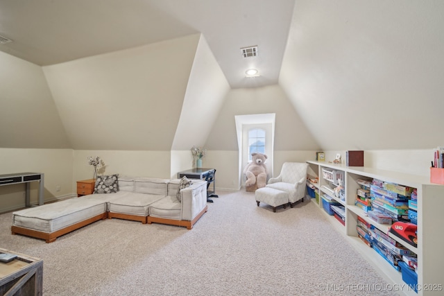 playroom with vaulted ceiling and carpet