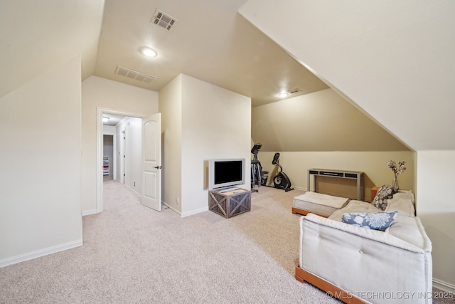 living room with lofted ceiling and light carpet