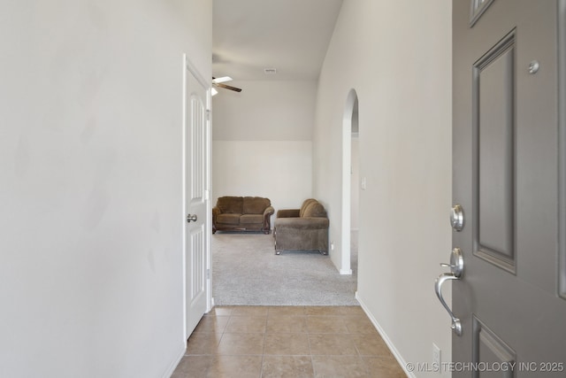 corridor with light colored carpet