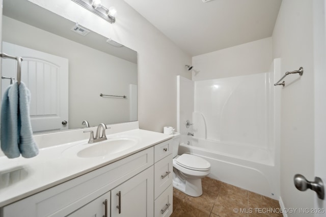 full bathroom featuring vanity, tub / shower combination, tile patterned floors, and toilet