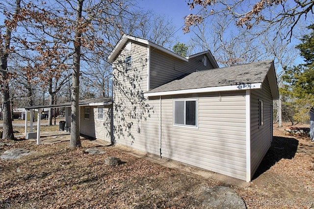 view of home's exterior featuring a carport