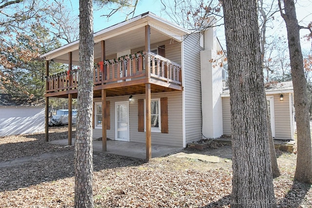 view of side of home featuring a patio area