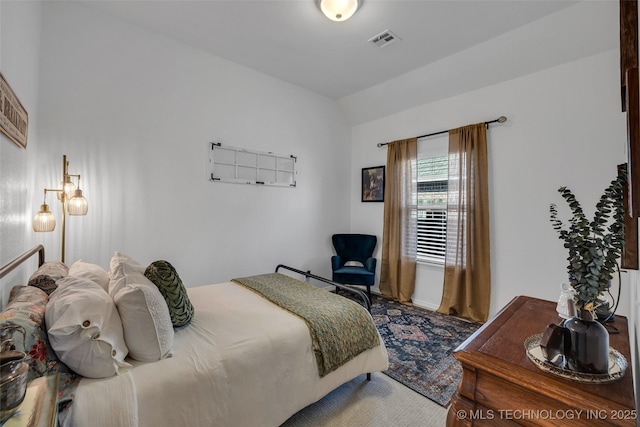 bedroom featuring vaulted ceiling