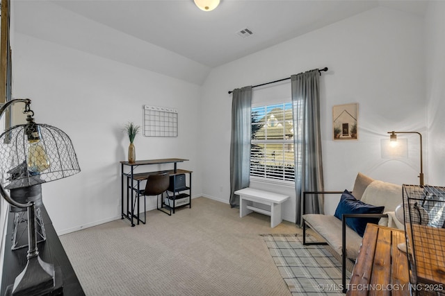 sitting room featuring lofted ceiling and light colored carpet