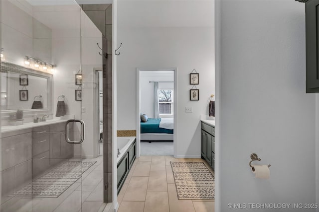 bathroom with vanity, tile patterned flooring, and shower with separate bathtub