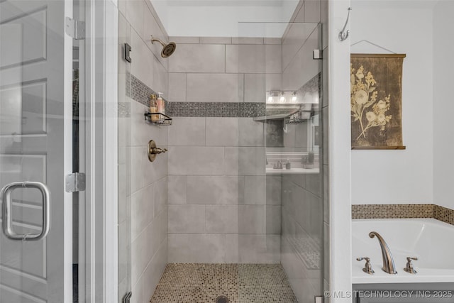 bathroom with shower with separate bathtub