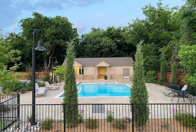 view of swimming pool with a patio area