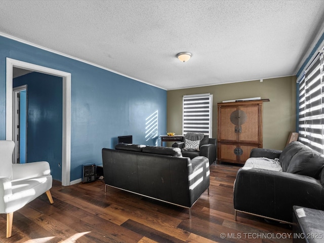 living room featuring dark hardwood / wood-style floors and a textured ceiling