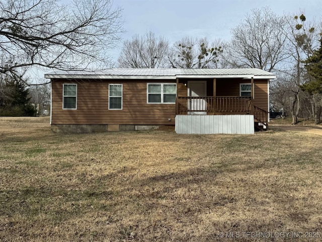 back of house with a yard