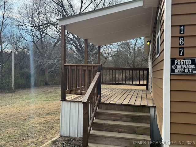 wooden deck with a yard