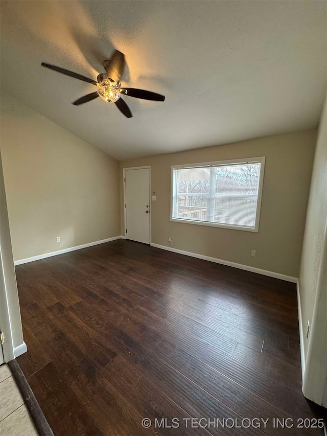 unfurnished room featuring ceiling fan and dark hardwood / wood-style flooring