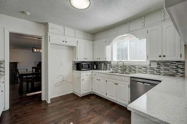 kitchen with sink, white cabinetry, stainless steel appliances, tasteful backsplash, and dark hardwood / wood-style flooring