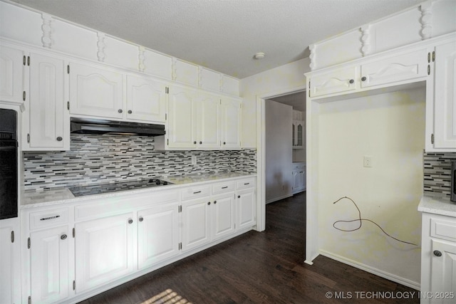 kitchen featuring white cabinetry, dark hardwood / wood-style flooring, tasteful backsplash, and black appliances