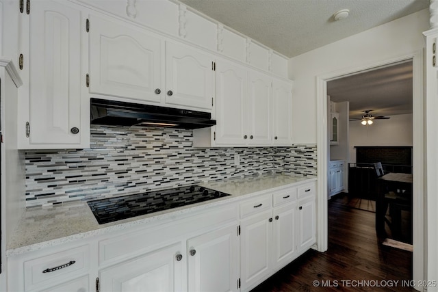 kitchen with white cabinets and black stovetop