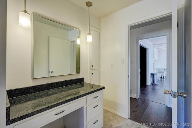 bathroom featuring vanity and wood-type flooring