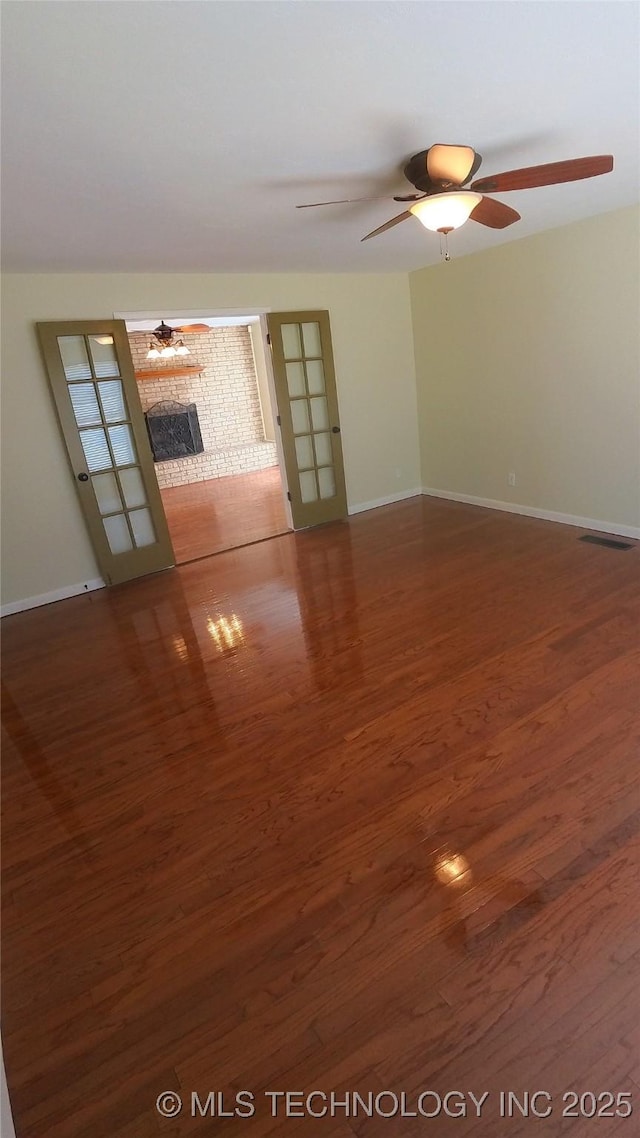 unfurnished room featuring wood-type flooring and ceiling fan