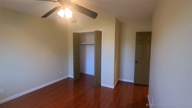 unfurnished bedroom with dark wood-type flooring and ceiling fan