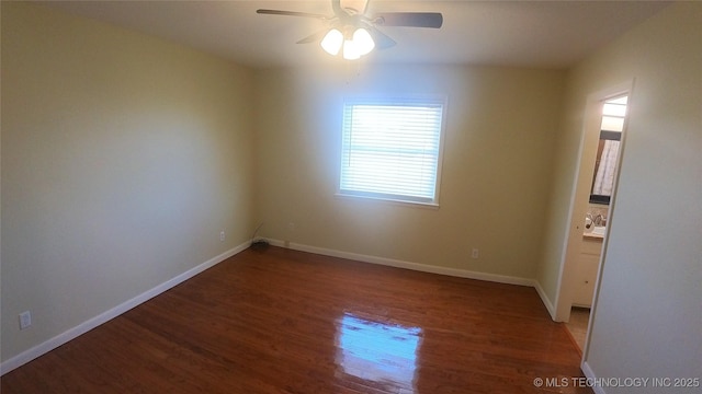 empty room featuring hardwood / wood-style floors and ceiling fan