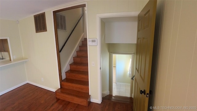 staircase featuring hardwood / wood-style floors