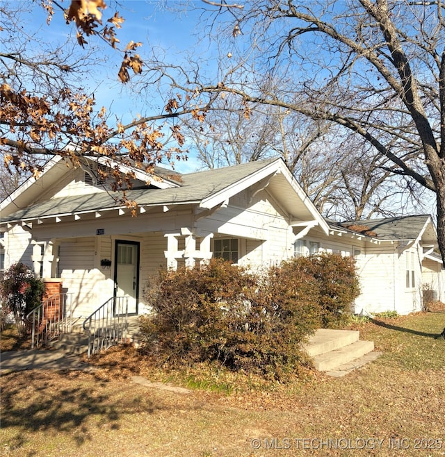 view of home's exterior with a lawn