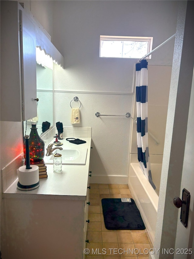 bathroom featuring vanity, tile patterned floors, and shower / bath combo