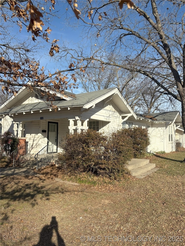 view of property exterior featuring a yard