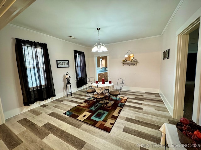 dining area featuring wood-type flooring, ornamental molding, and a notable chandelier