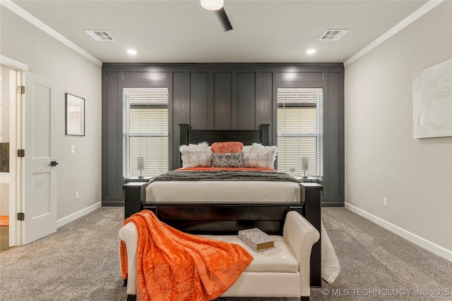 bedroom featuring ornamental molding, light colored carpet, and ceiling fan