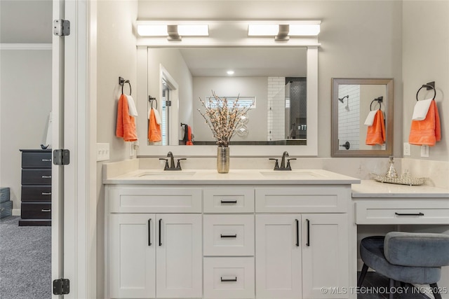 bathroom with ornamental molding and vanity