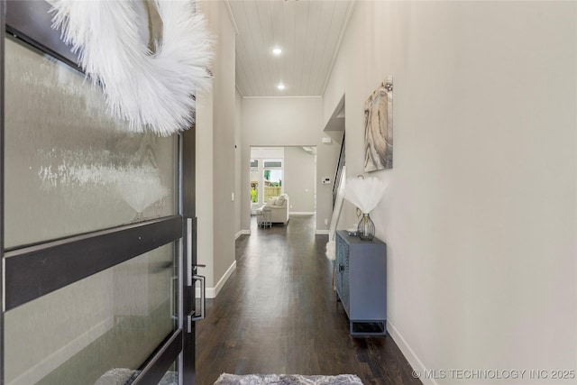 hallway with dark hardwood / wood-style floors