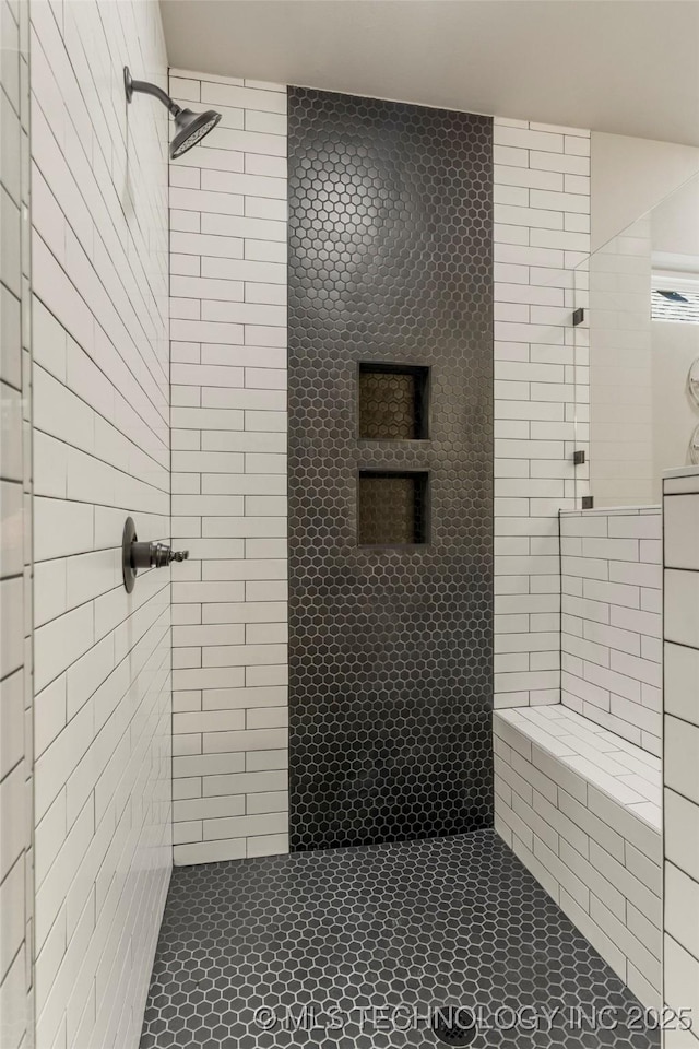 bathroom featuring tiled shower