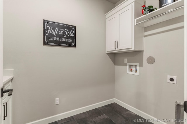 washroom featuring washer hookup, cabinets, and hookup for an electric dryer