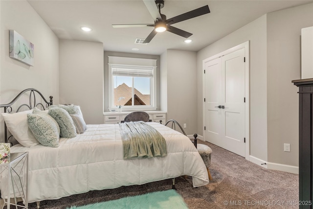 bedroom with ceiling fan and carpet flooring