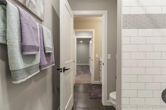 bathroom featuring tile patterned floors and toilet