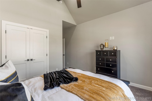 carpeted bedroom featuring ceiling fan, vaulted ceiling, and a closet