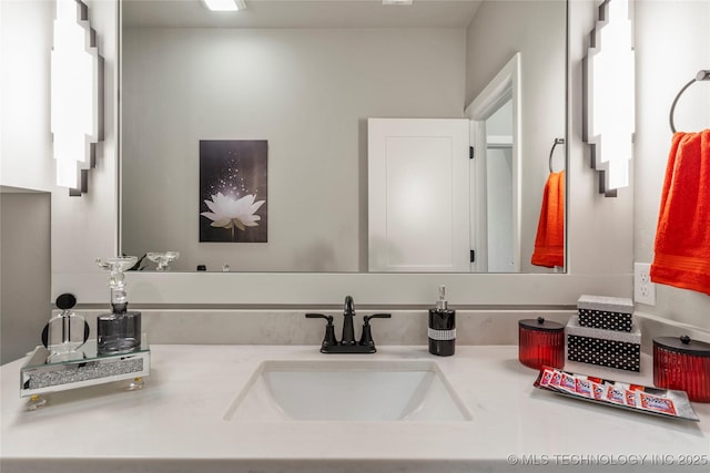 bathroom with vanity and a wealth of natural light