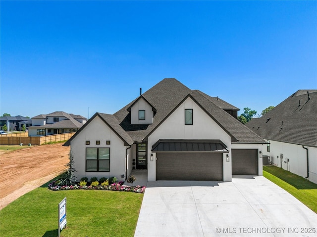 french provincial home featuring a garage, central AC unit, and a front yard