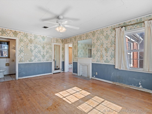 spare room featuring ceiling fan and light wood-type flooring