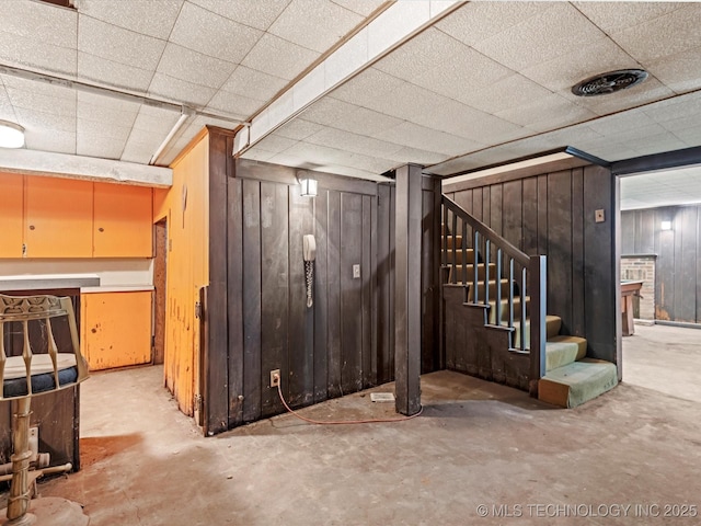 basement with wooden walls